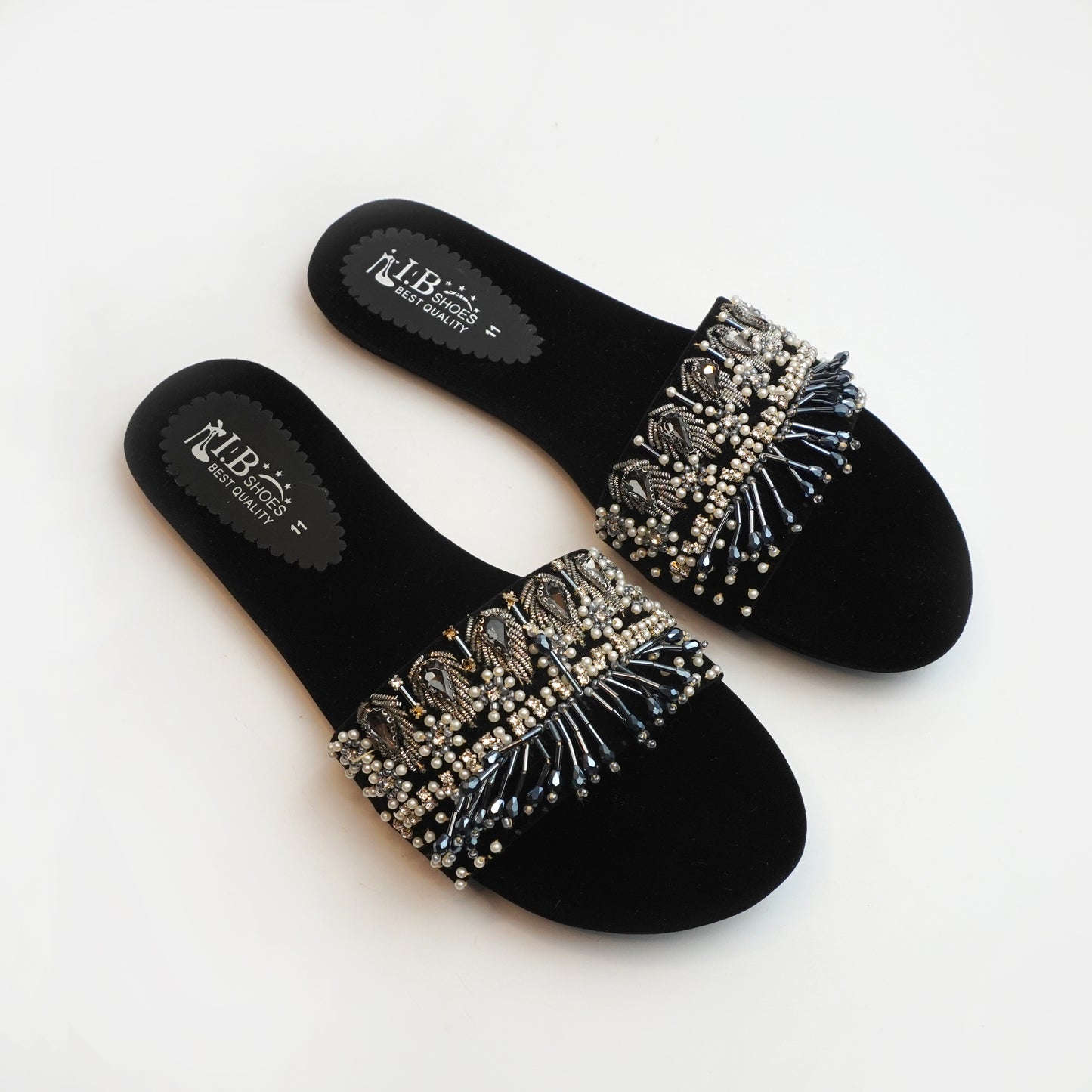 Nolva Velvet Shine black velvet sandals with golden and black bead embellishments – luxury flat footwear for women’s party and festive wear