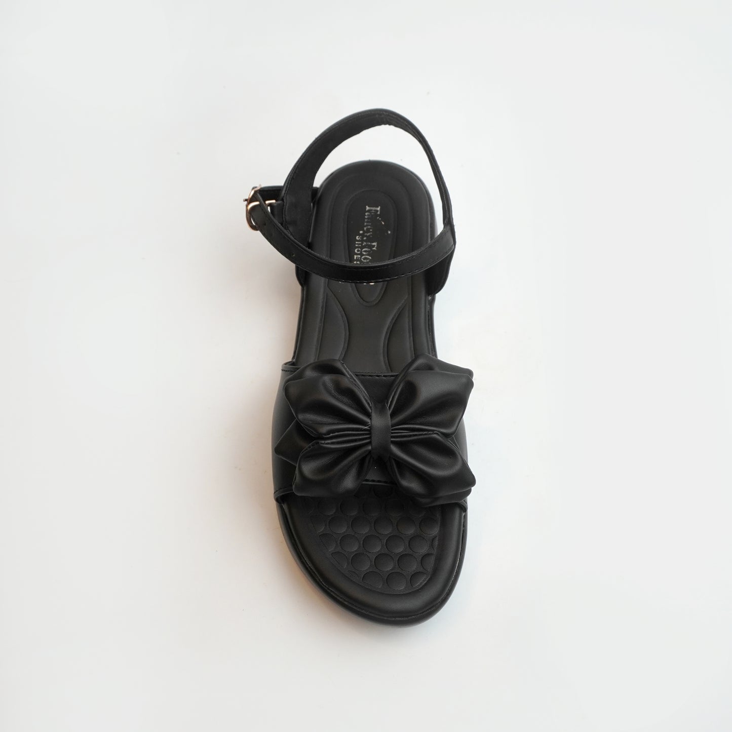 Women’s tan flat sandals with bow detail – comfortable and trendy casual summer footwear.