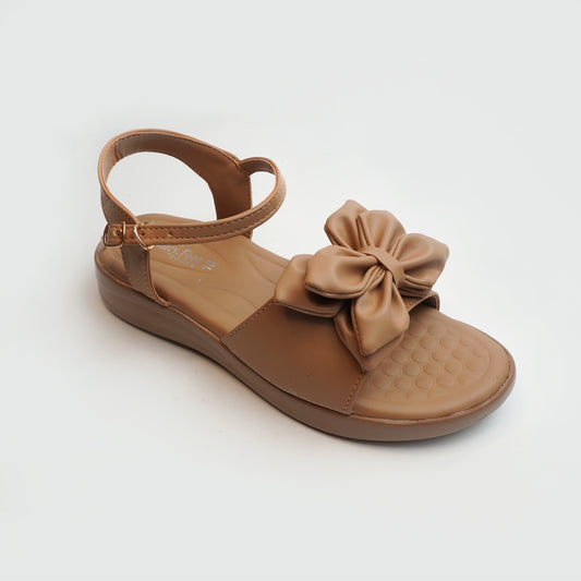 Women’s tan flat sandals with bow detail – comfortable and trendy casual summer footwear.