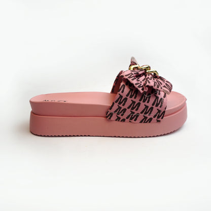 Nolva women’s Pink slide sandal with oversized printed bow and gold chain buckle—cushioned flat for casual wear.